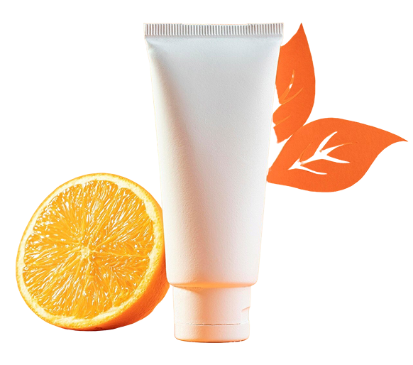 White skincare tube next to fresh orange half and orange leaf cutouts